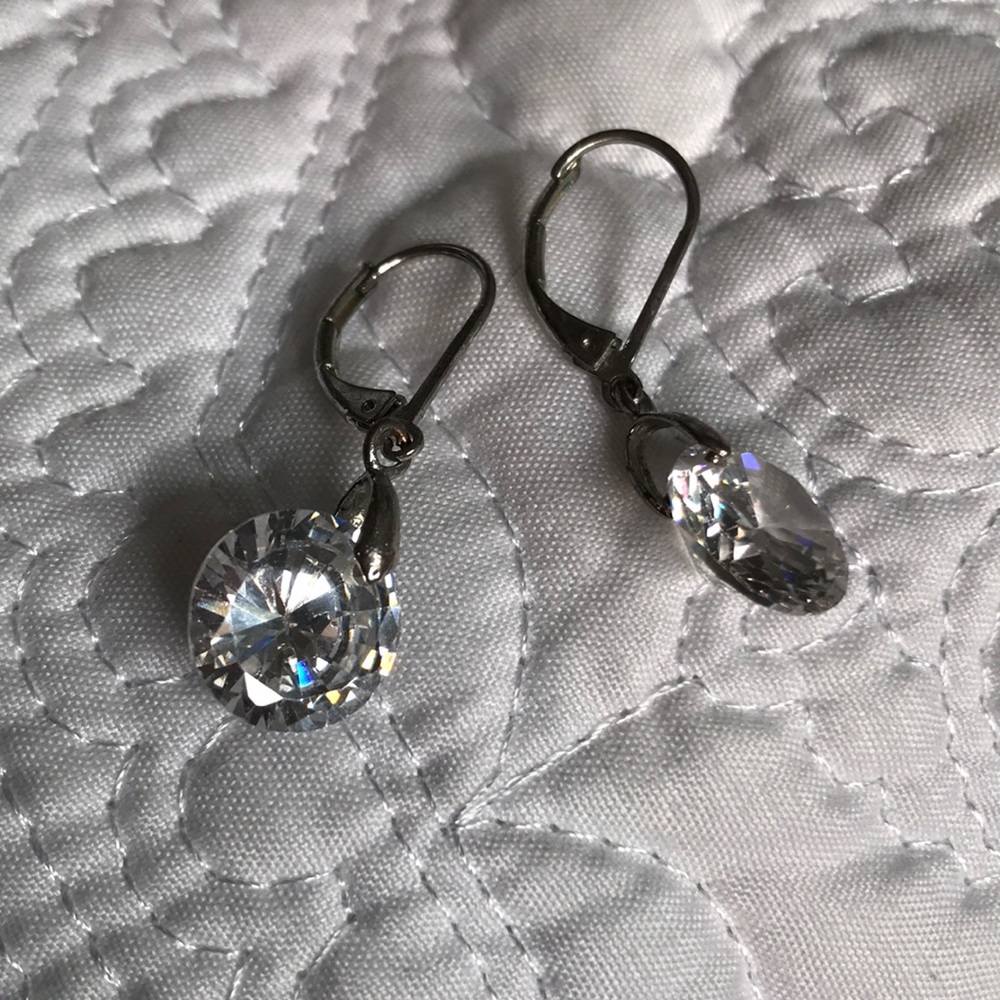 Large diamond shape clear stones dangle earrings